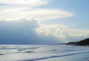 Partly cloudy skies over Hilton Head Island with gentle waves.