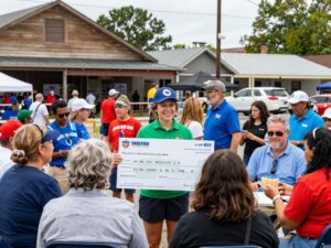 Community members celebrating a Powerball win in Beaufort near local businesses