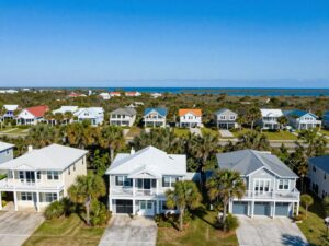 Scenic view of housing on Hilton Head Island with palm trees and coastal landscape.